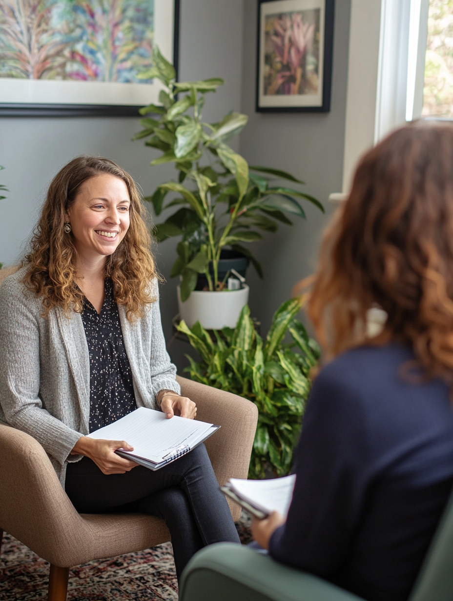 A smiling healthcare professional engaging with a patient, representing compassionate care in behavioral health.