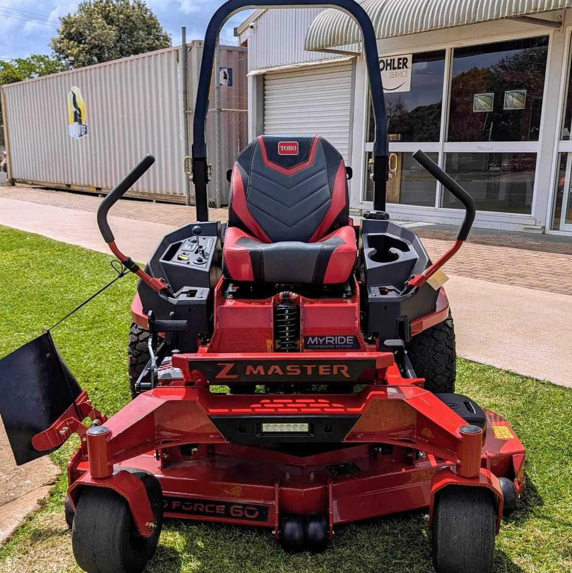 Red Z Master Zero-turn Mower Parked Outside a Building on a Lawn — Casali's in Mareeba, QLD