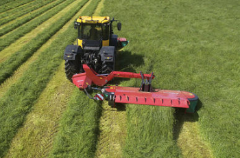 Yellow Tractor Mowing Green Grass With Red Cutting Attachment in a Field — Casali's in Mareeba, QLD