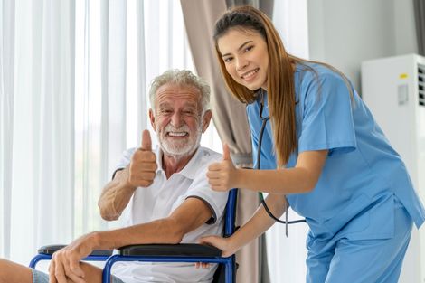 Nurse with man in wheelchair