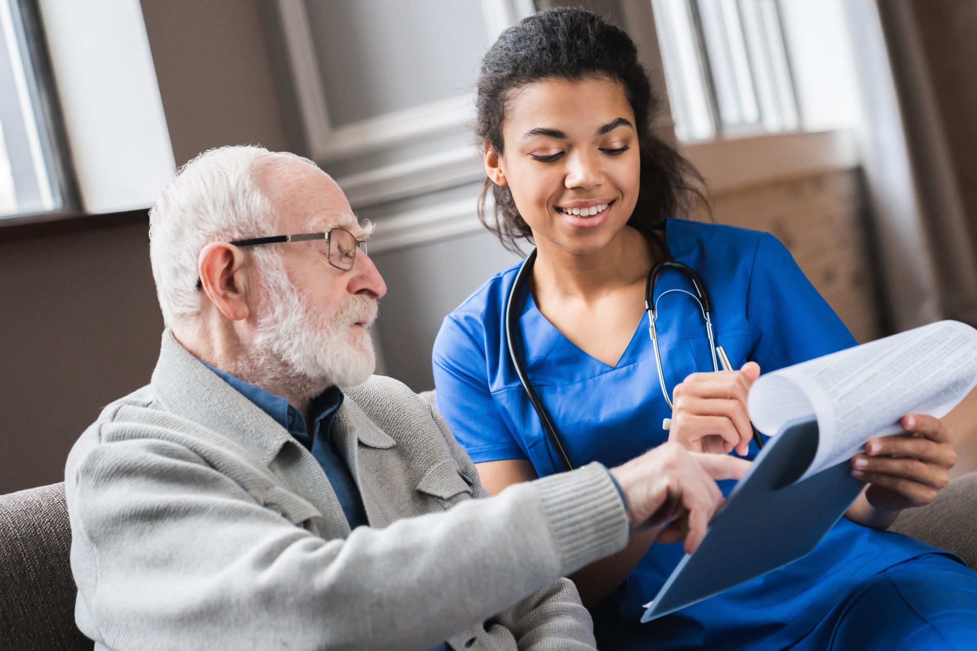 Nurse helping elderly man