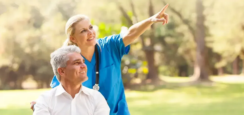 Nurse with man in wheelchair