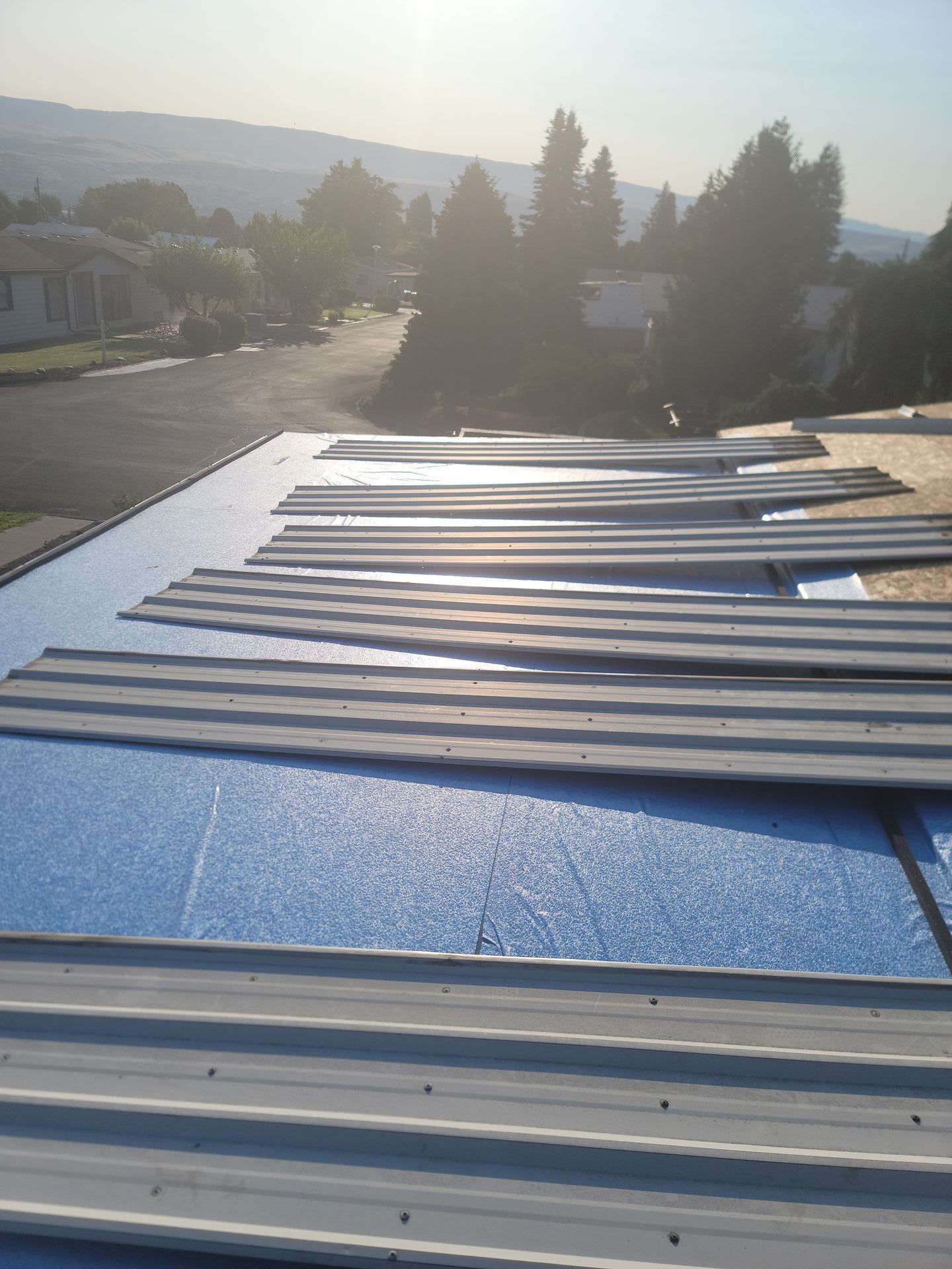 A roof with a lot of metal sheets on it