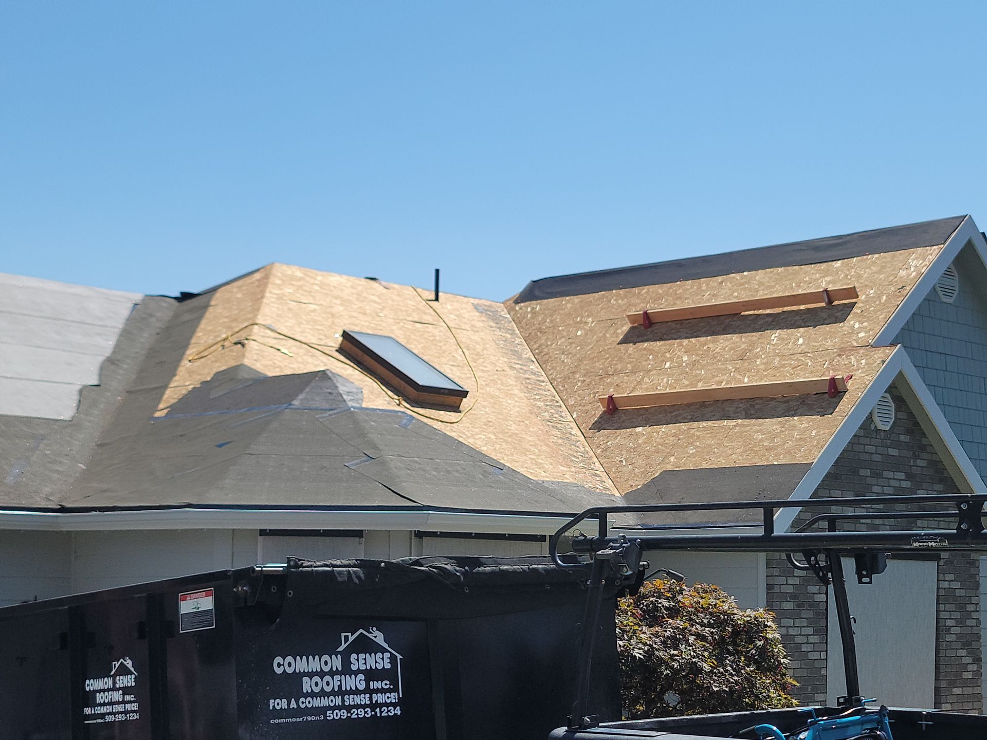 A house with a roof that is being remodeled