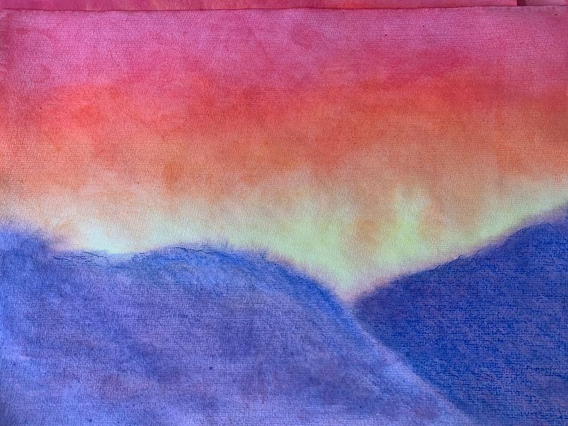 Wet-on-wet watercolour painting in pink, green and blue — a hallmark of Steiner art education