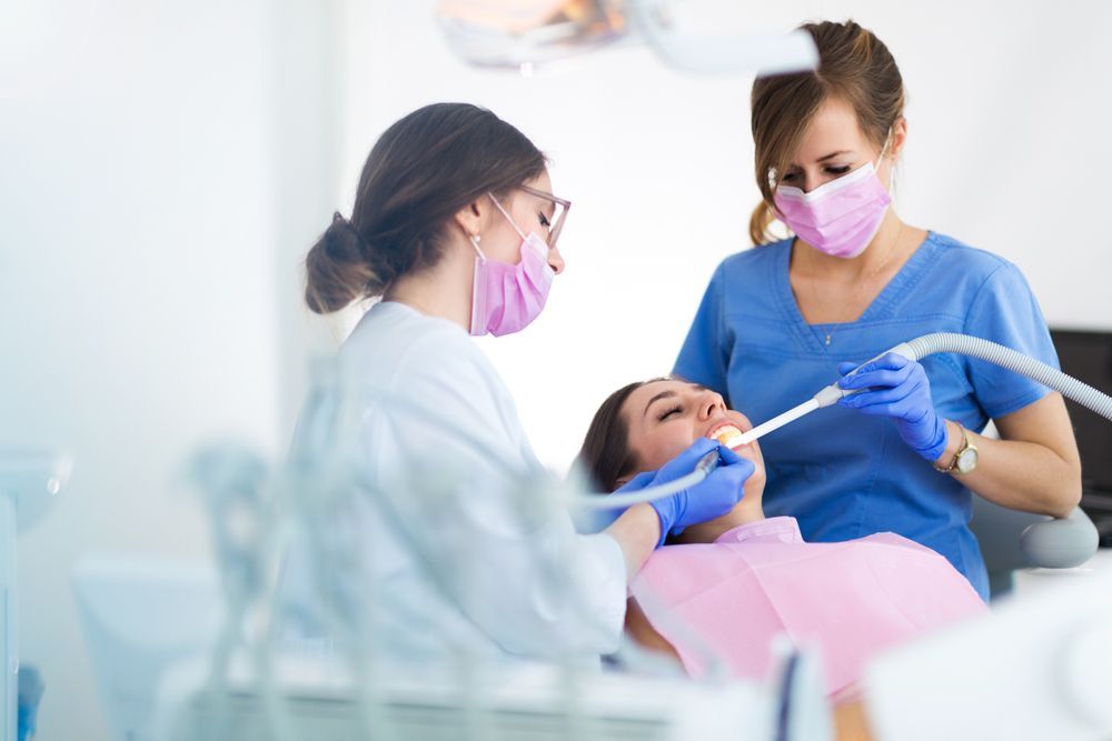 Dentist With Assistant Examining Patient's Teeth — St Ives Dental Boutique In Saint Ives, NSW