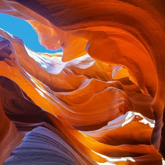 View looking up into a canyon with blue sky in Sedona near Southwest Inn Sedona