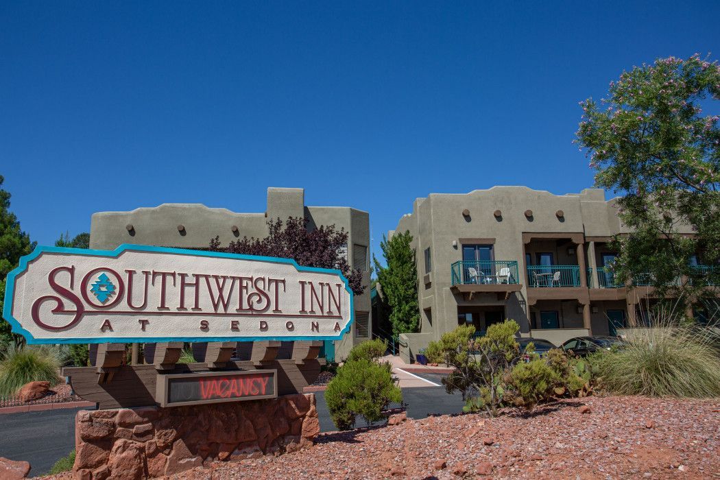 Southwest Inn Sedona sign in front of the building, welcoming guests to the hotel