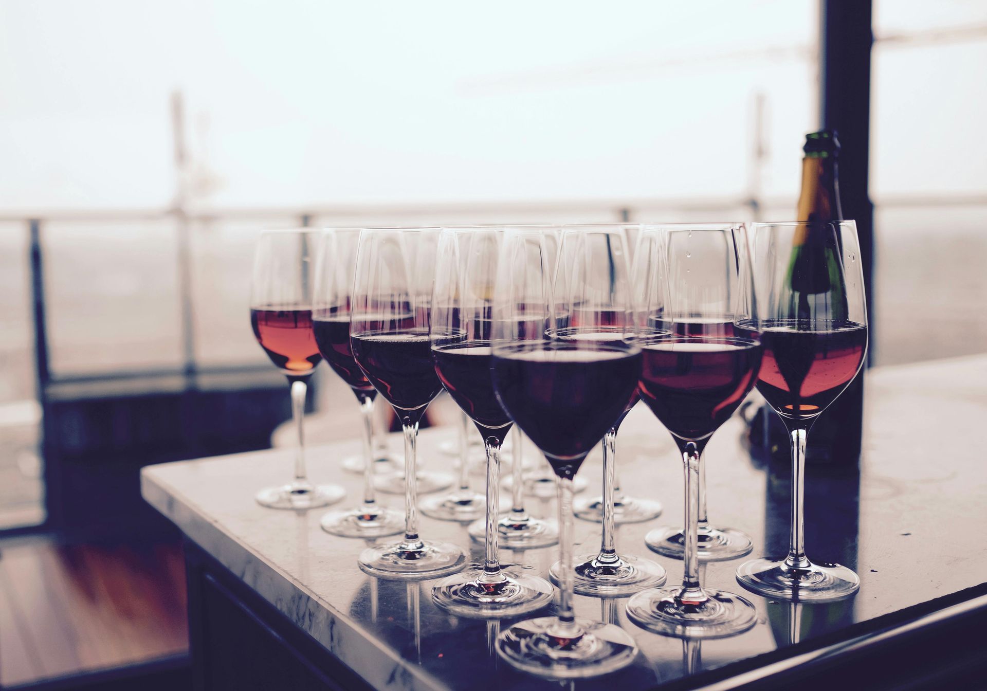Row of wine glasses lined up on a table during a Sedona wine tasting near Southwest Inn Sedona