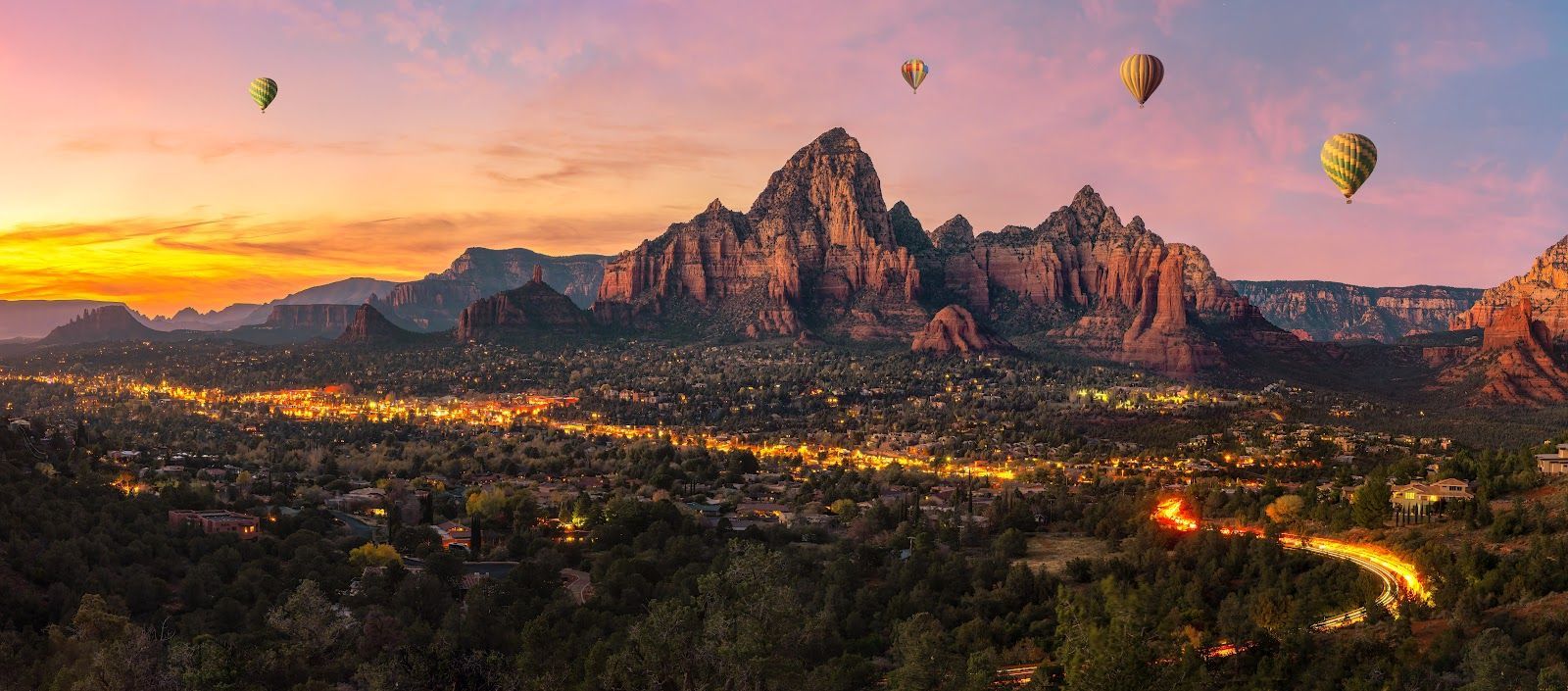 Hot air balloons over Sedona red rocks at sunset