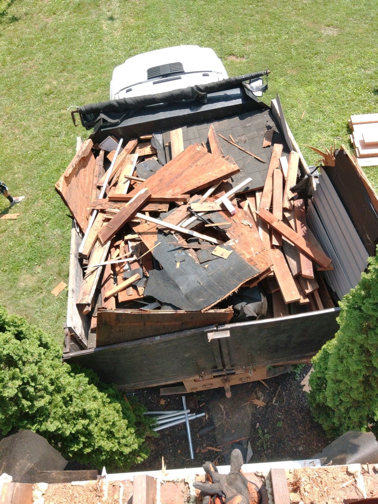 An aerial view of a dumpster filled with wood