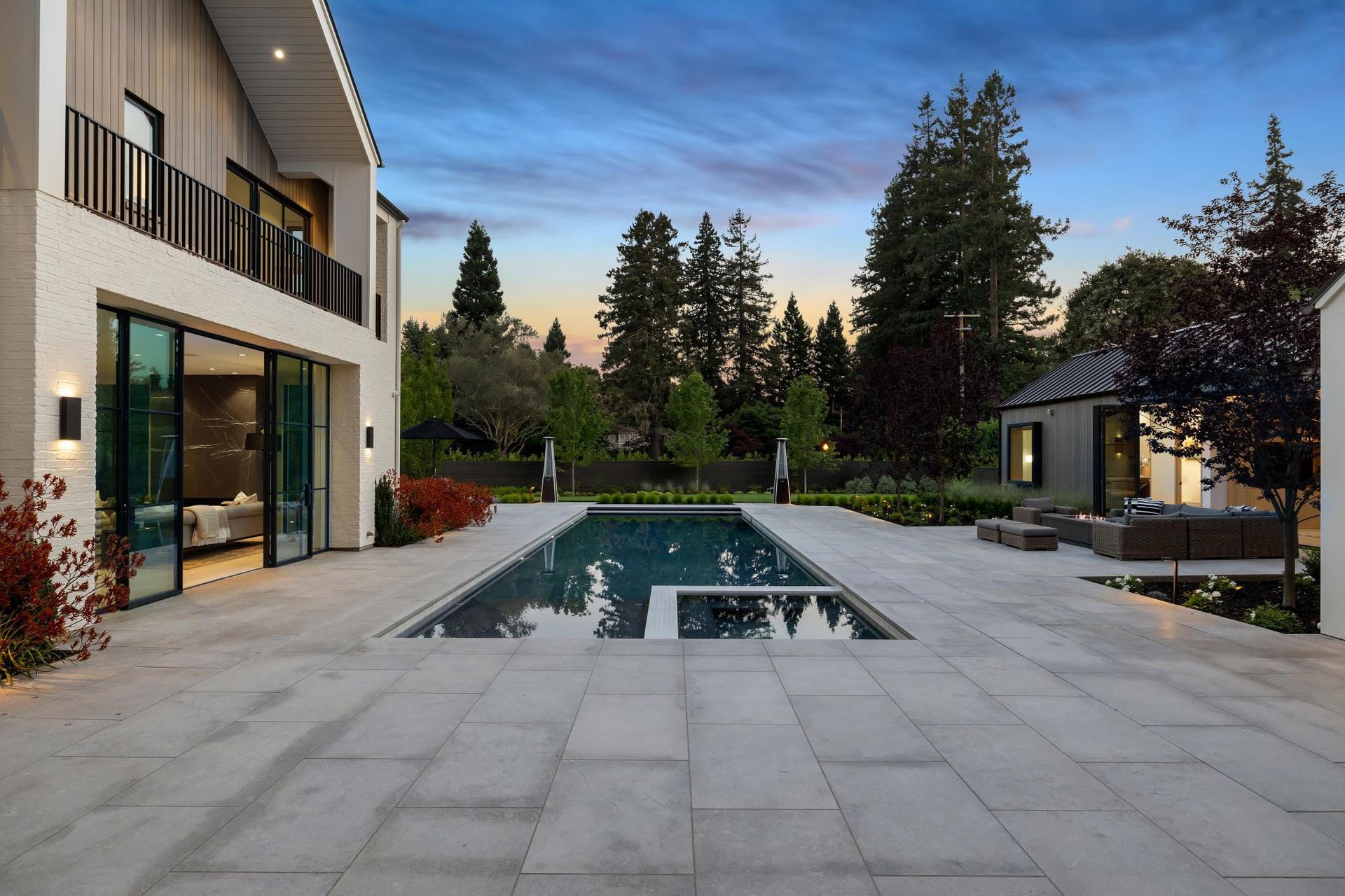 A large house with a large swimming pool in the backyard.