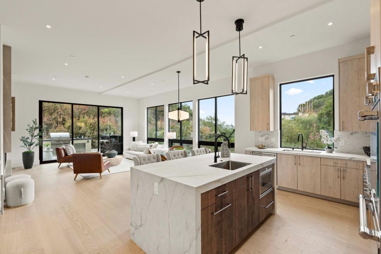 There is a large island in the middle of the kitchen.