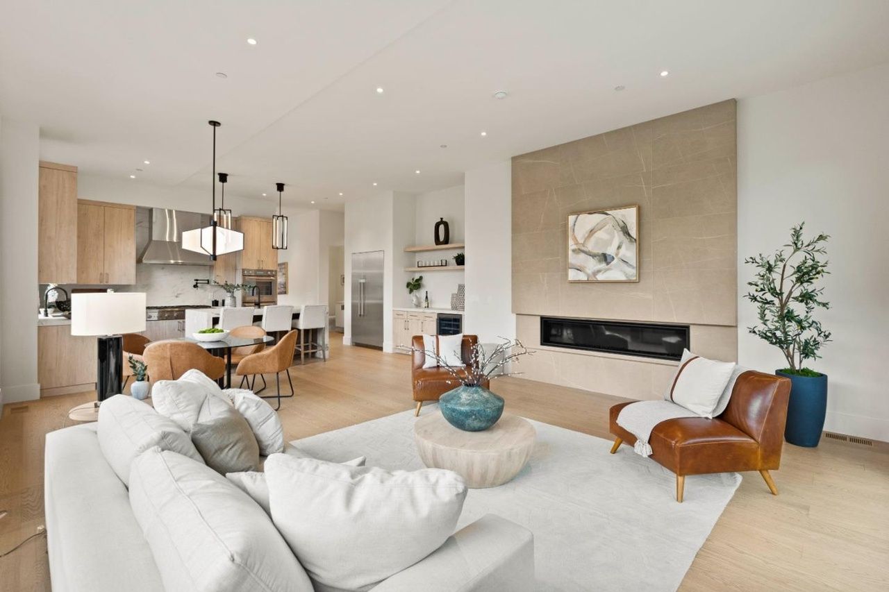 A living room filled with furniture and a fireplace.