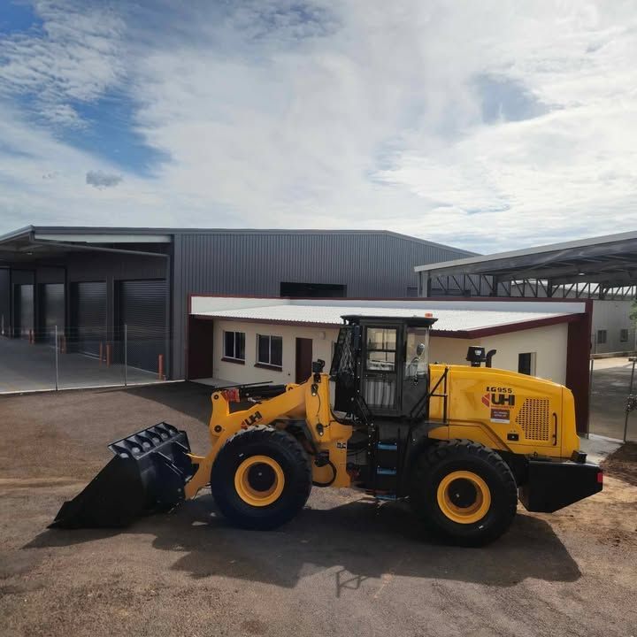 Yellow Front Loader Parked Outside a Building Under a Cloudy Sky — All things Diesel NT in Tivendale, NT
