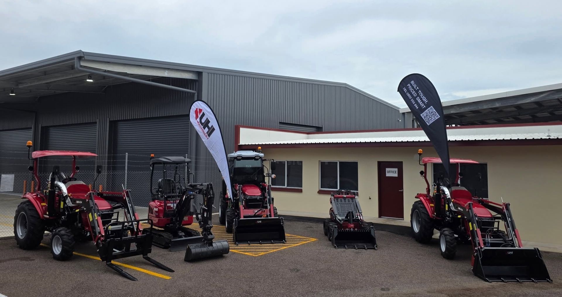 Red and Black Lawn Mowers Displayed Outside a Dealership Building — All things Diesel NT in Tivendale, NT