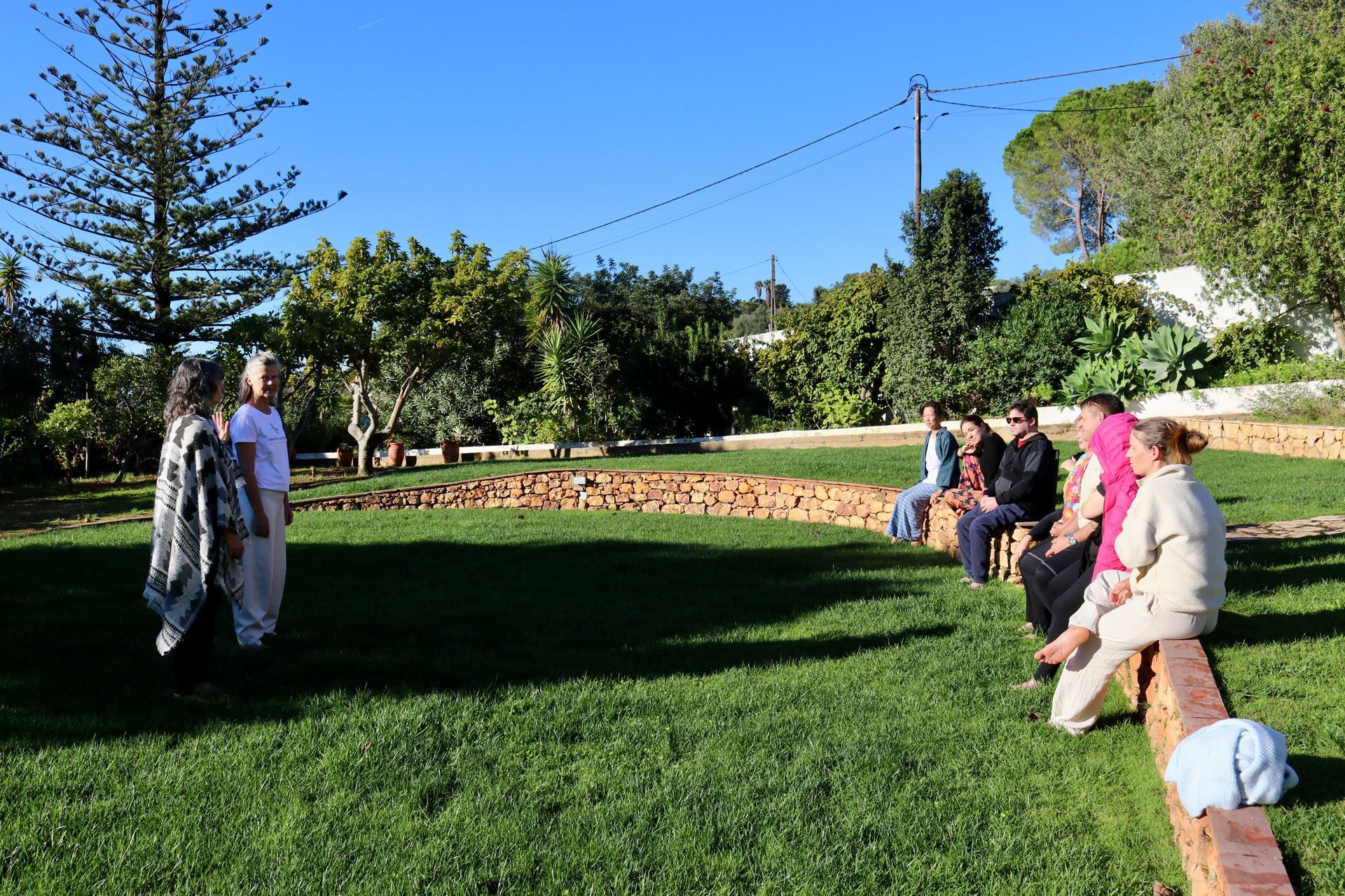 Regina and Maria facilitating outdoors