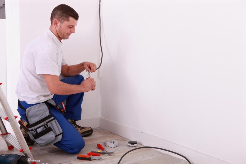 worker cutting the wire