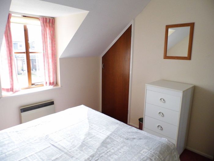 Albion Cottage double bedroom showing drawers and wardrobe.