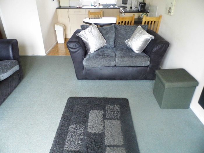 Albion Cottage living room with 2-seater sofa.