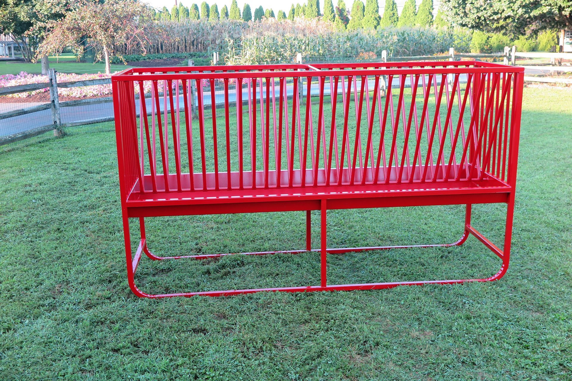 Red Stoltzfus Manufacturing fence line livestock feeder with skid base