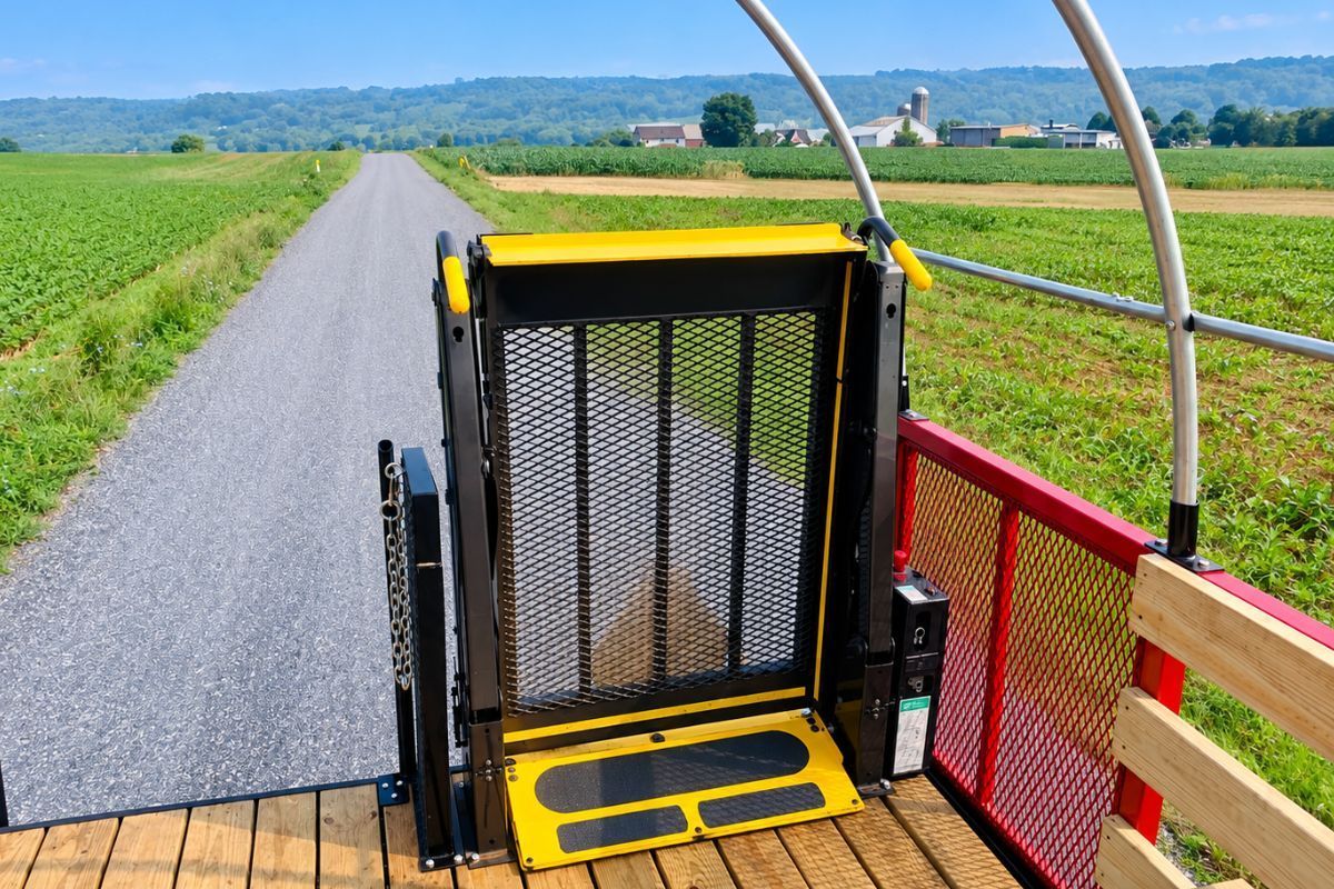 Hayride wagon with raised wheelchair lift and wooden bench seating by Stoltzfus Manufacturing