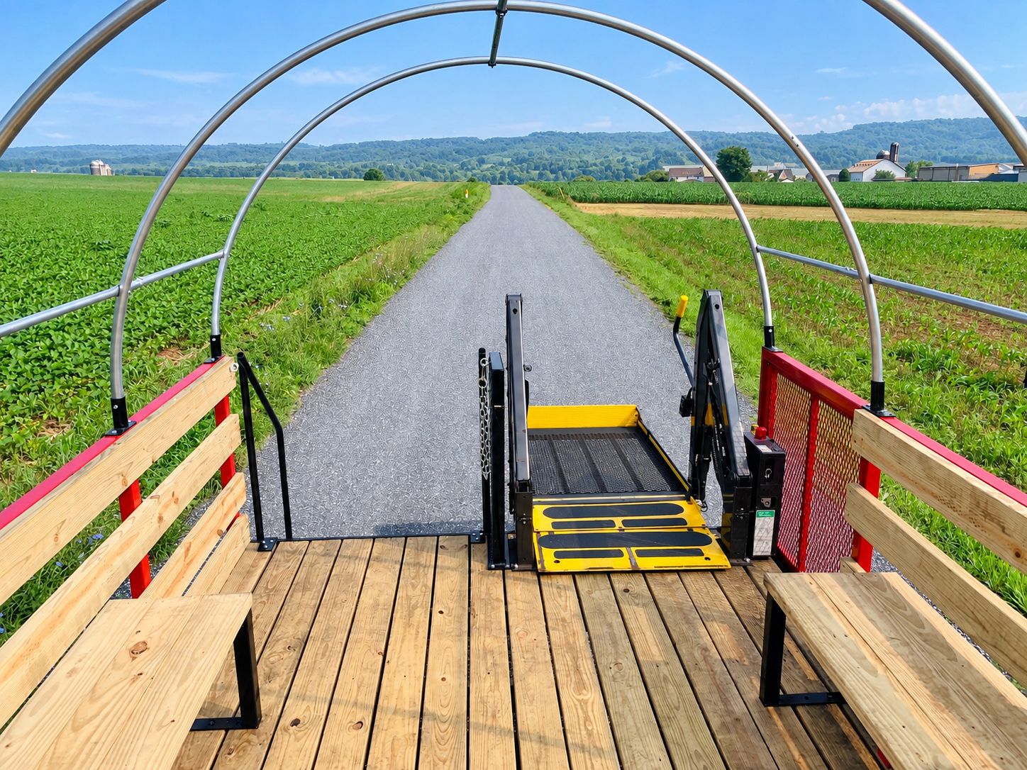 Hayride wagon with wheelchair lift and wooden bench seating by Stoltzfus Manufacturing