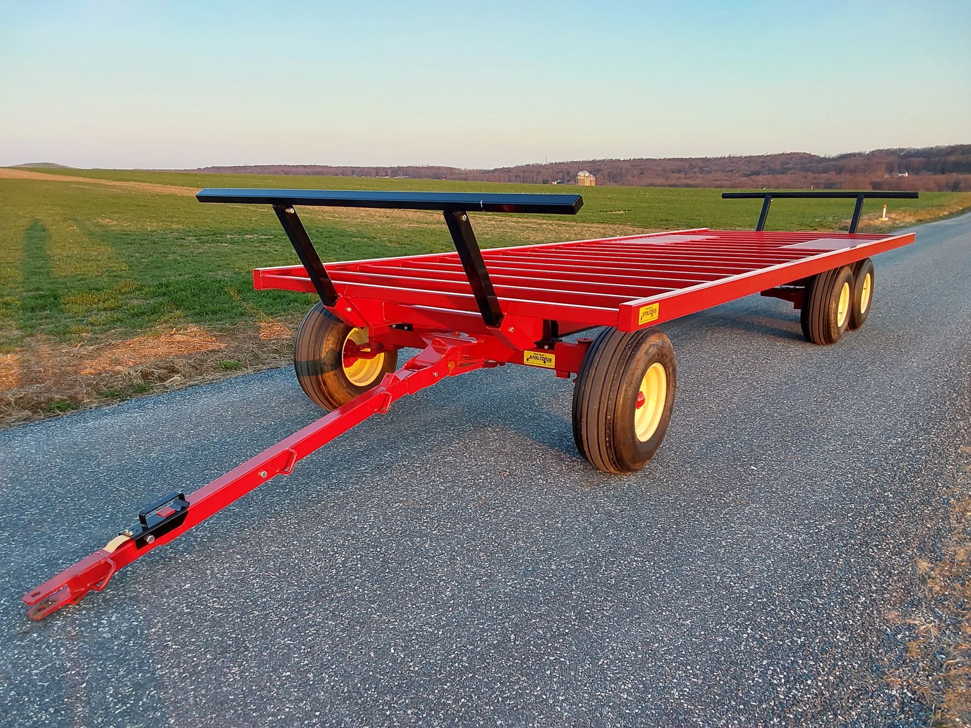 Green Stoltzfus bale wagon designed for hauling hay bales on the farm