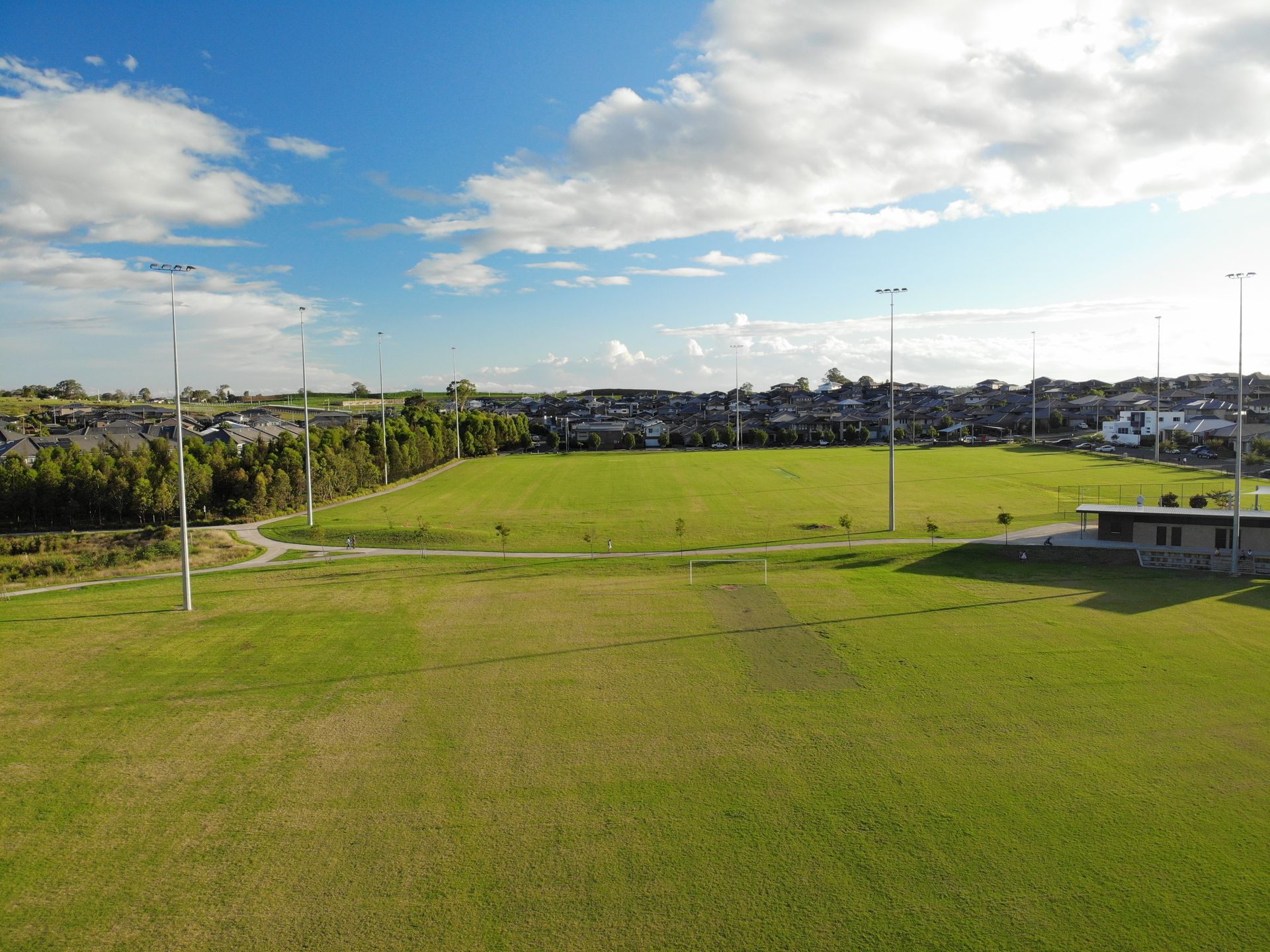 Wide Grassy Sports Field Under a Partly Cloudy Sky — Edmonds Turf in Louth Park, NSW