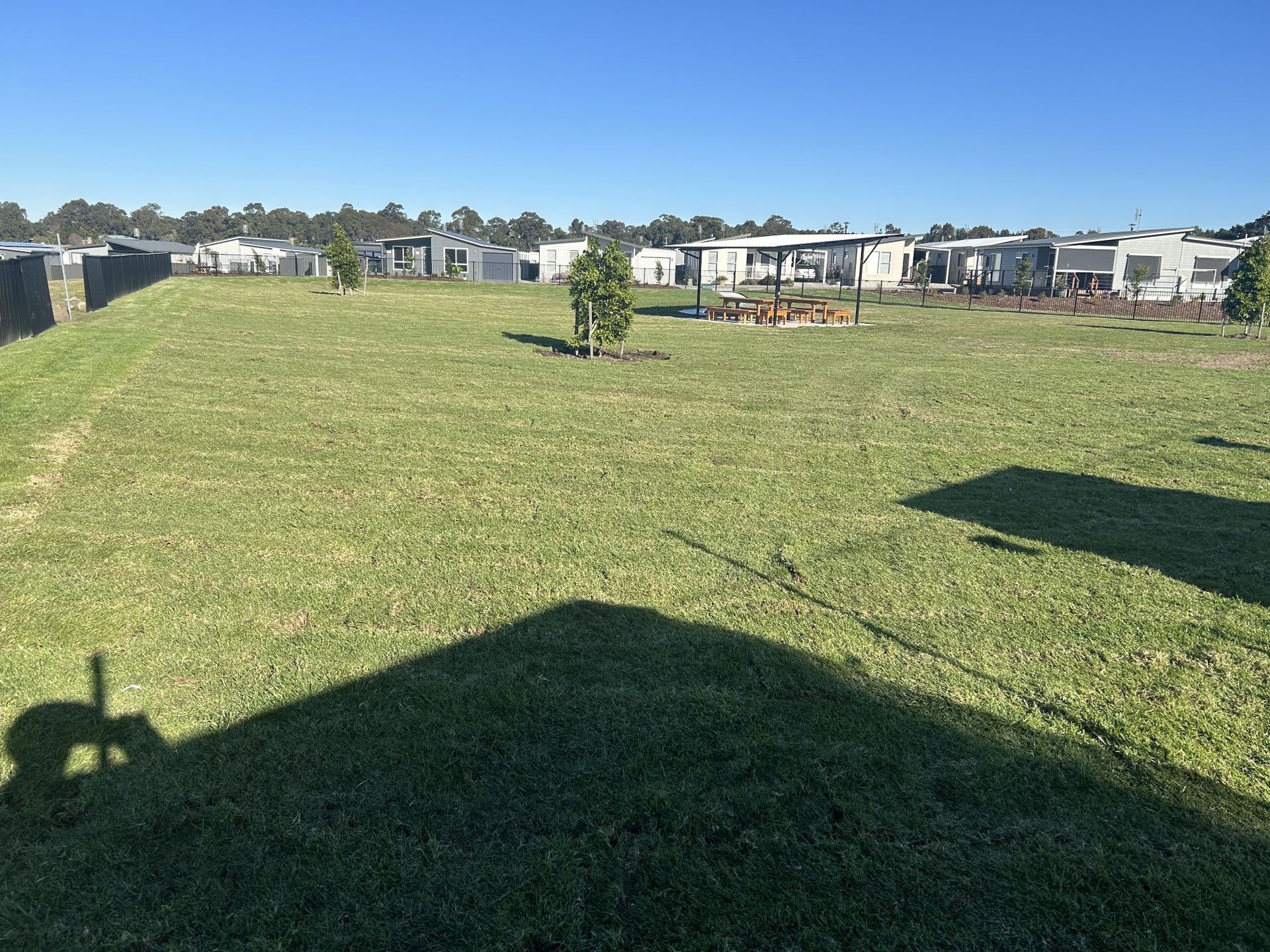 Grassy Field With Scattered Mobile Homes — Edmonds Turf in Louth Park, NSW