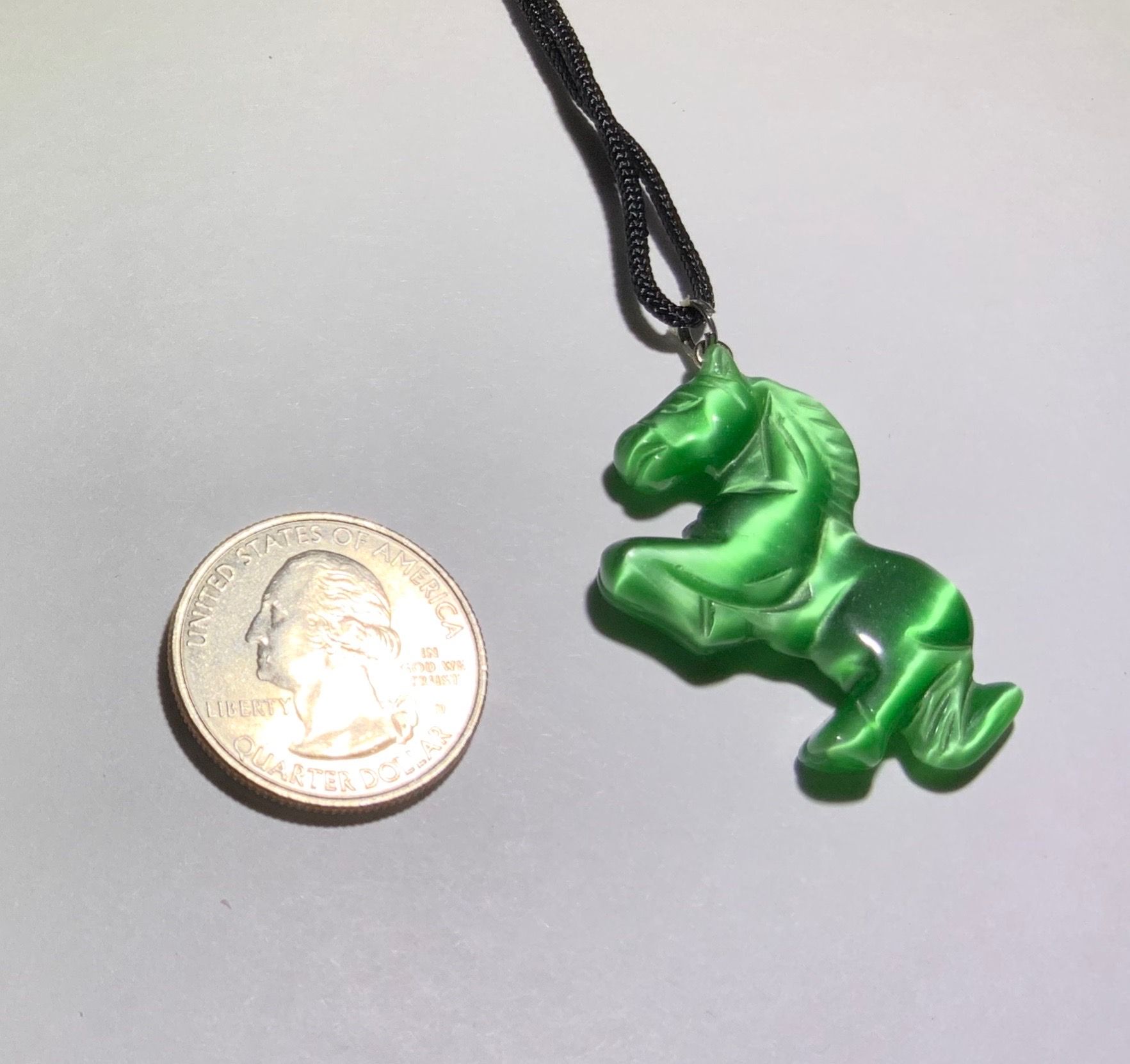 Green jumping horse pendant
