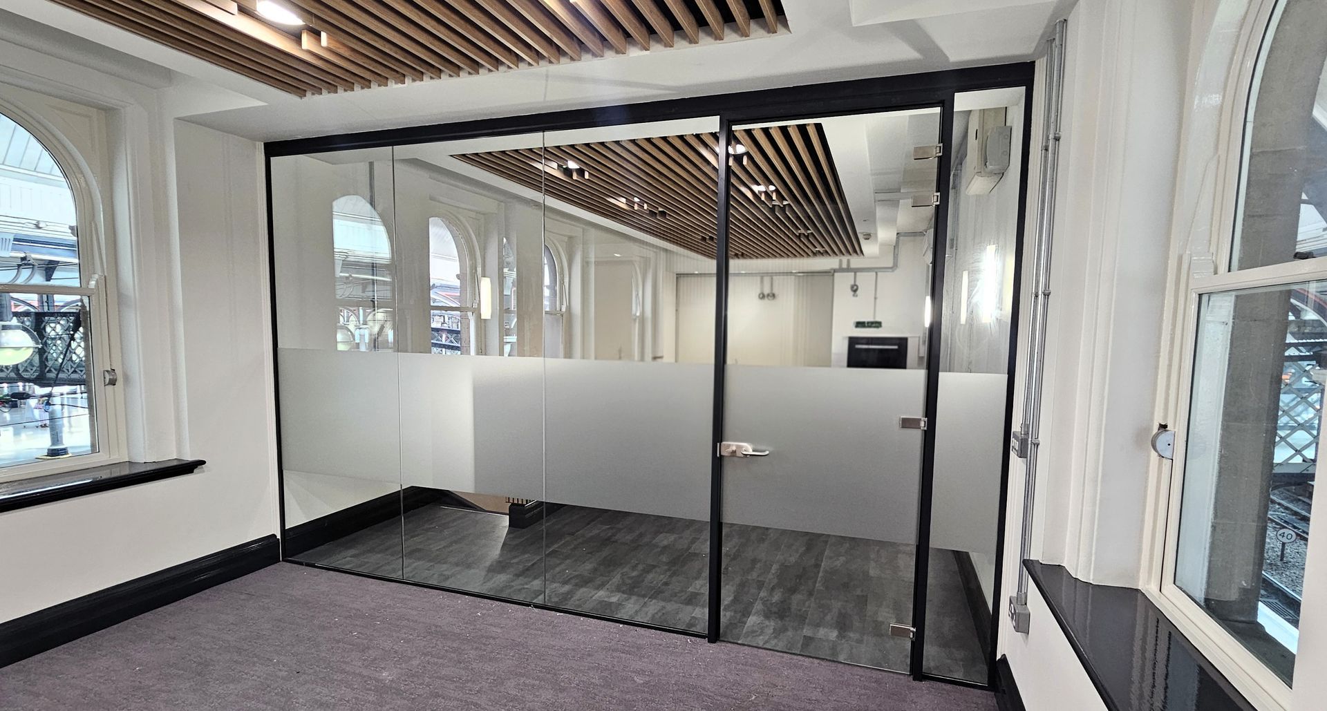 Single glazed office glass partition with slimline door frame and glass door installed in Newcastle upon Tyne