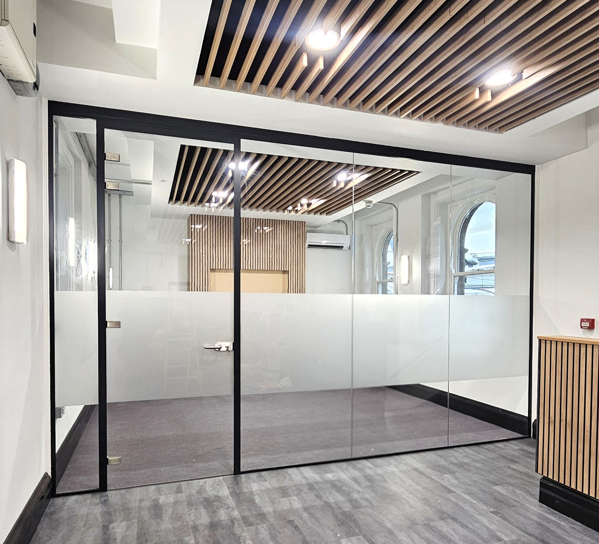 Single glazed office glass partition with slimline door frame and glass door installed at Newcastle Central Station