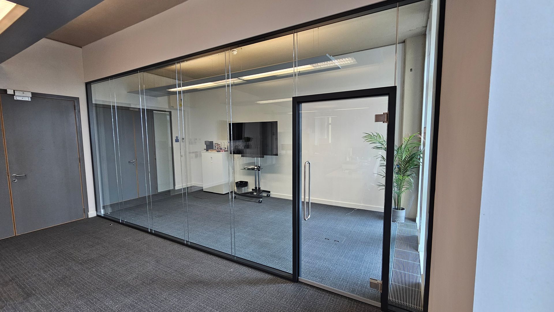 Double glazed acoustic glass partitions with glass door installed at Newcastle University Complex near St. James’s Park