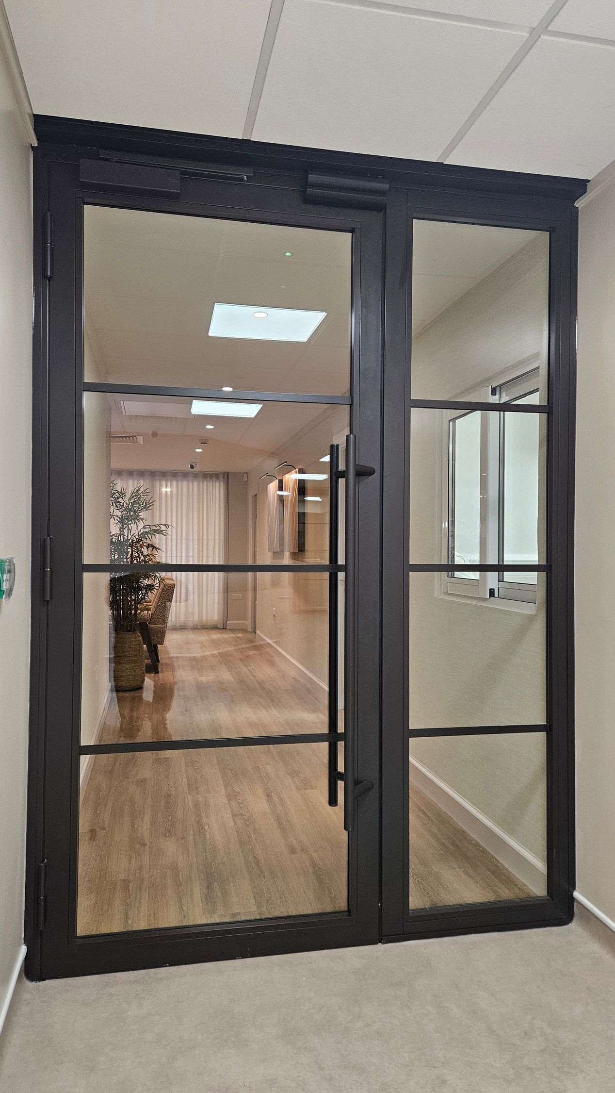 Completed E30 steel fire rated glass partition system by Clear Divide in Gateshead, North East.