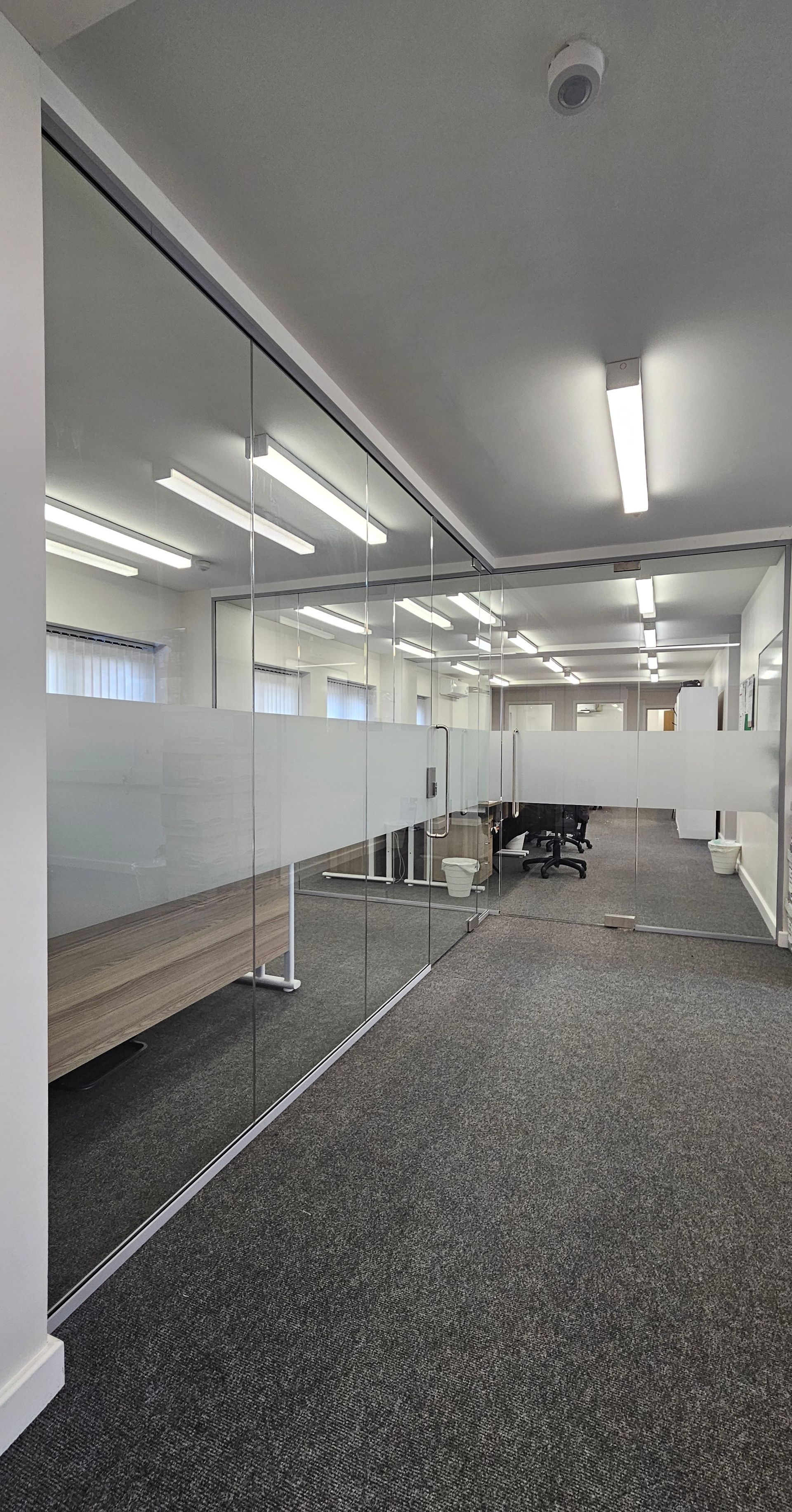 Modern frameless glazing system fitted in commercial workspace in South Shields