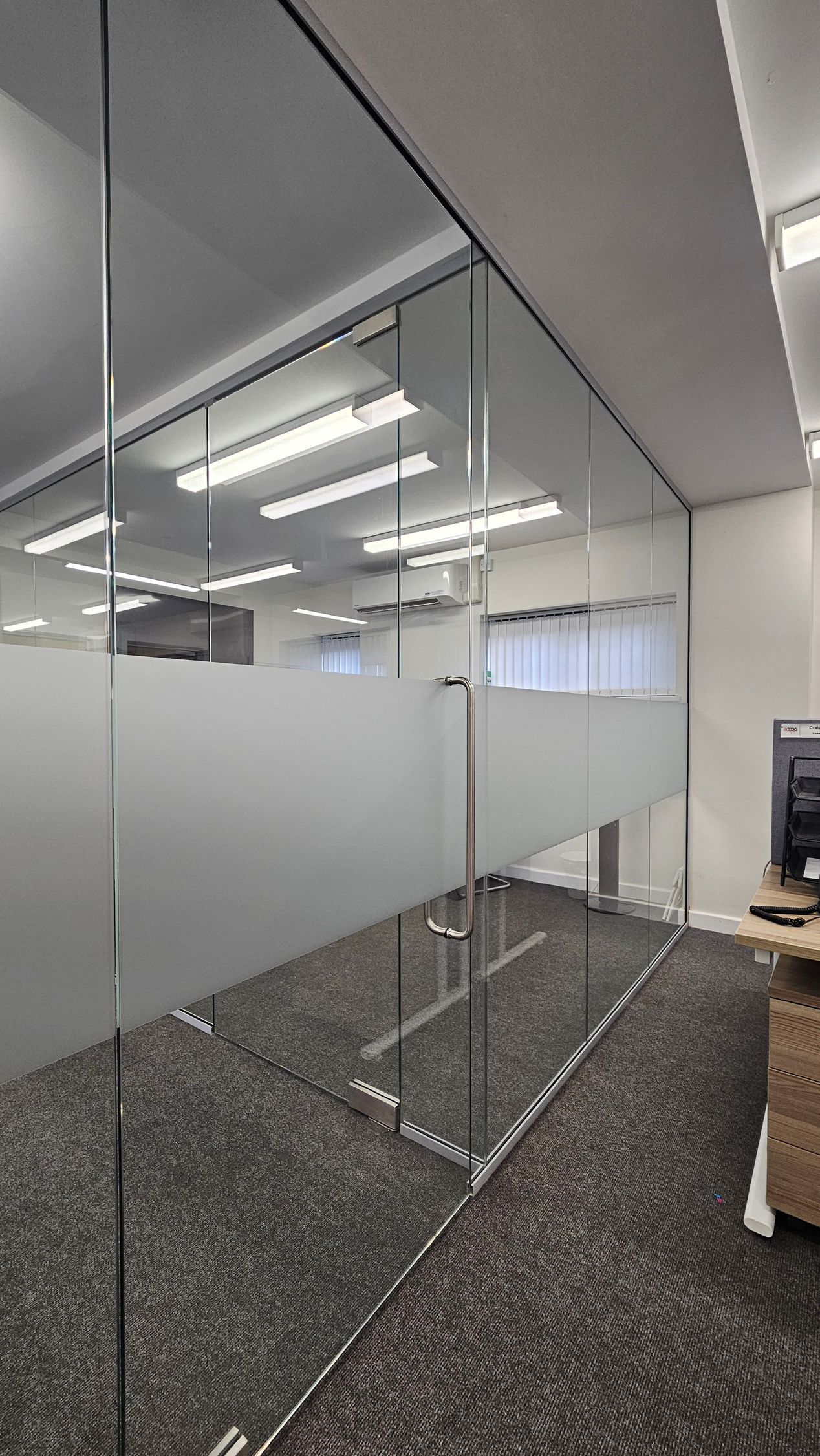 New office spaces created using sleek frameless glass partitions