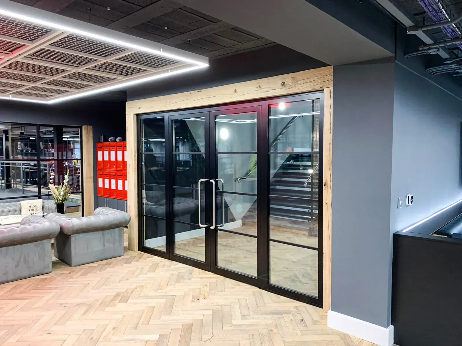 Steel Fire Screen and Steel Fire-Rated Double Glass Doors in a Commercial Setting