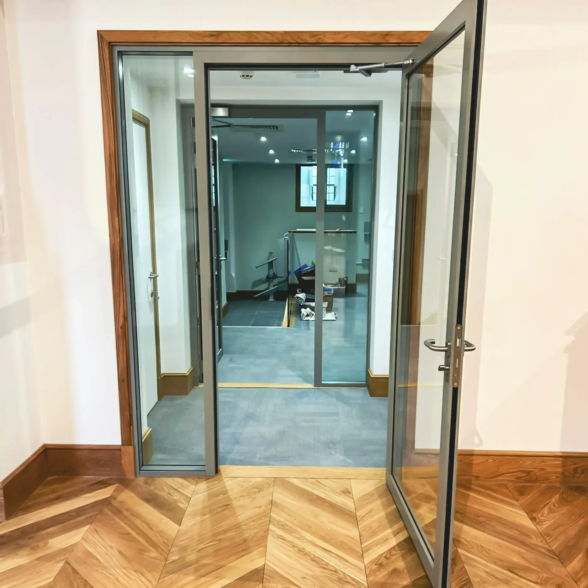 Steel Fire Screens and Steel Fire-Rated Glass Doors in a Commercial Setting