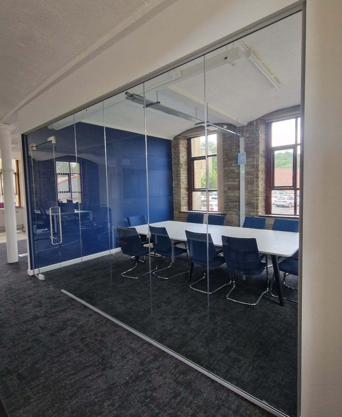 Single Glazed Office Partition with Frameless Glass Door including Glass Overpanel in Yorkshire on the outskirts of Leeds
