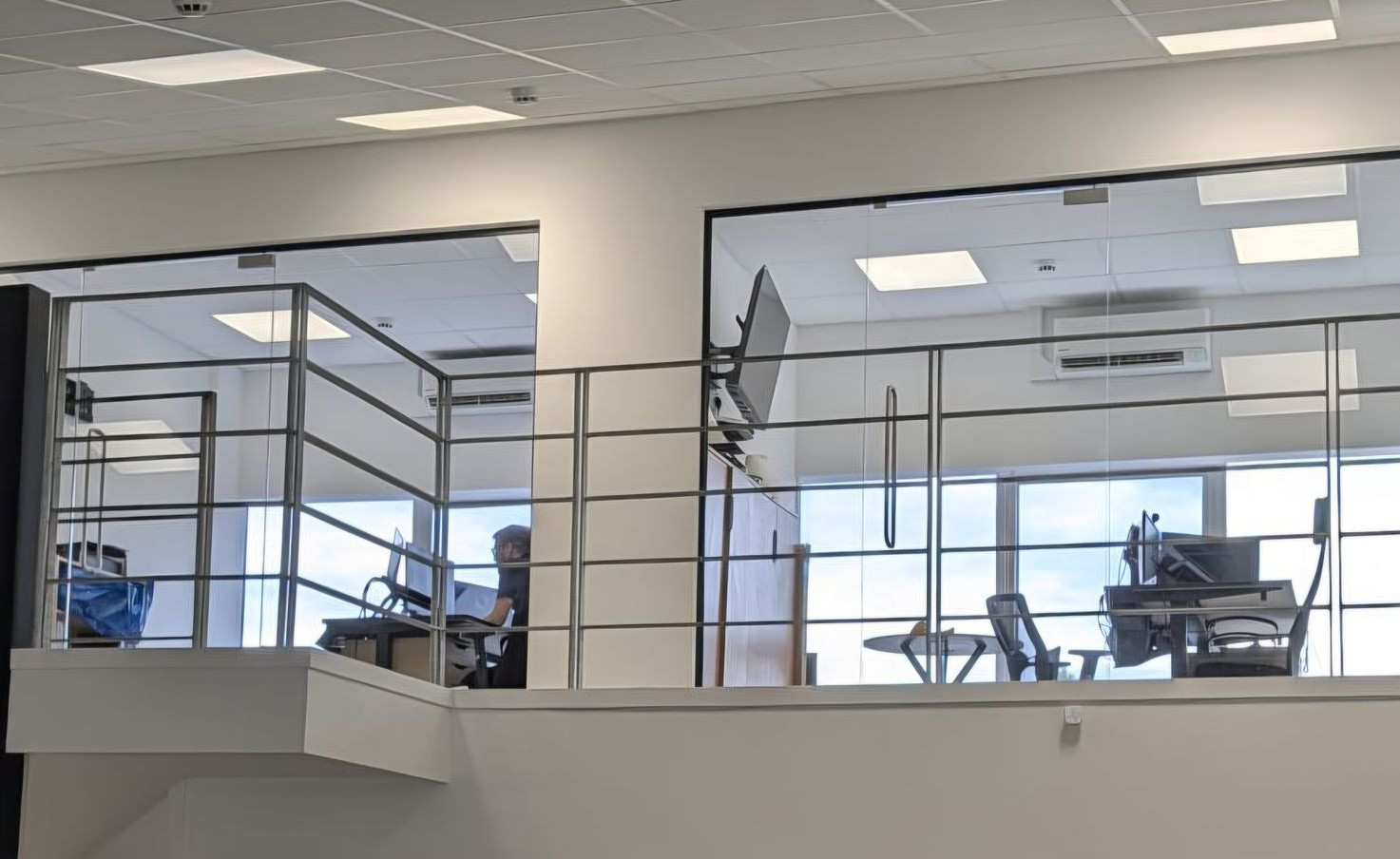 Frameless glass partitions installed on a mezzanine in Gateshead