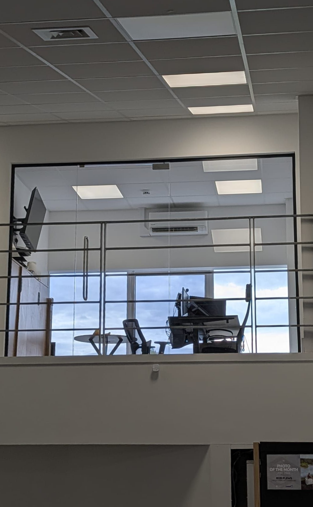 Modern mezzanine offices with frameless glass partitions by Clear Divide