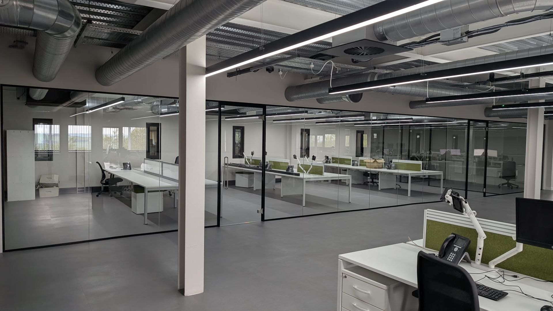 Modern acoustic office fit out with glass meeting rooms in Durham