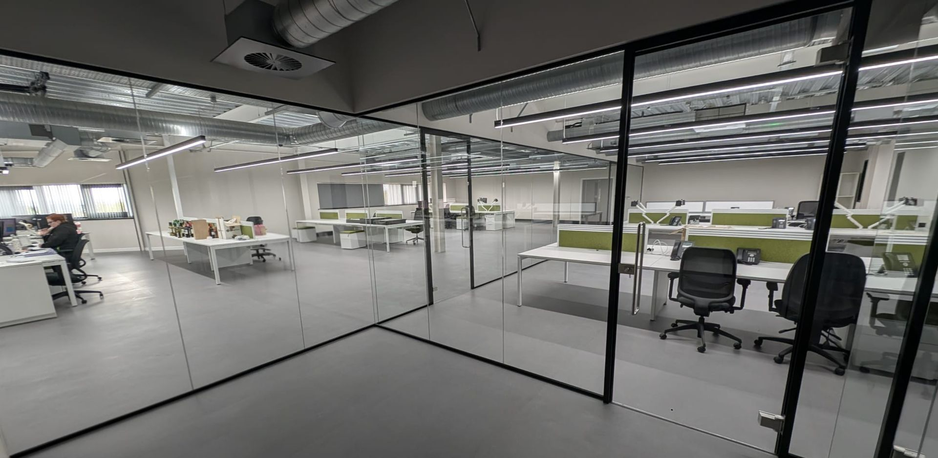 Black frameless glass meeting room partition system