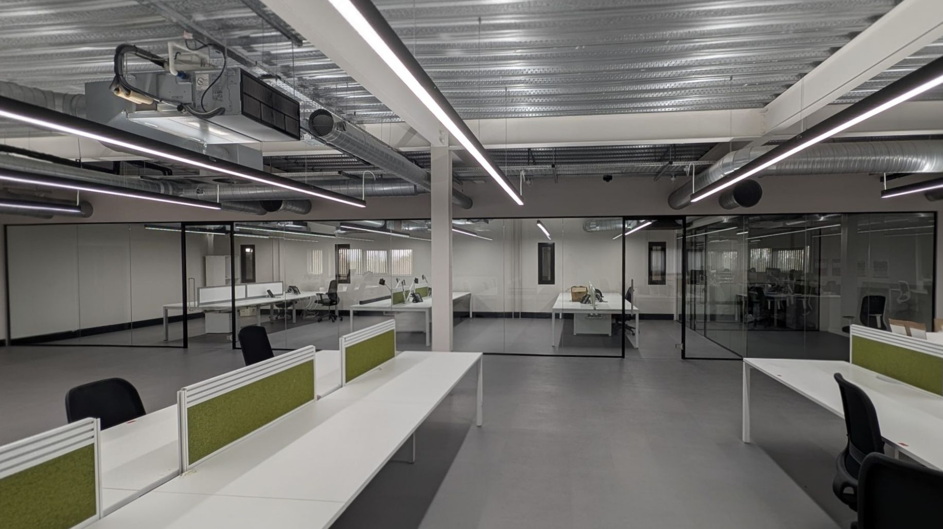 Private office space created using acoustic glass partitions