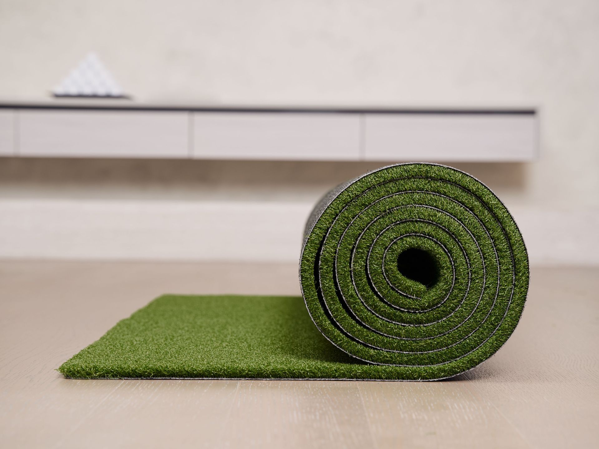 Man installing artificial grass in San Angelo, TX