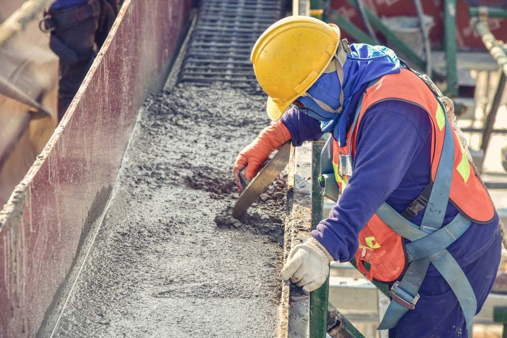 Construction Worker Wearing Hard Hat and Safety Vest — NBM Constructions in Canberra