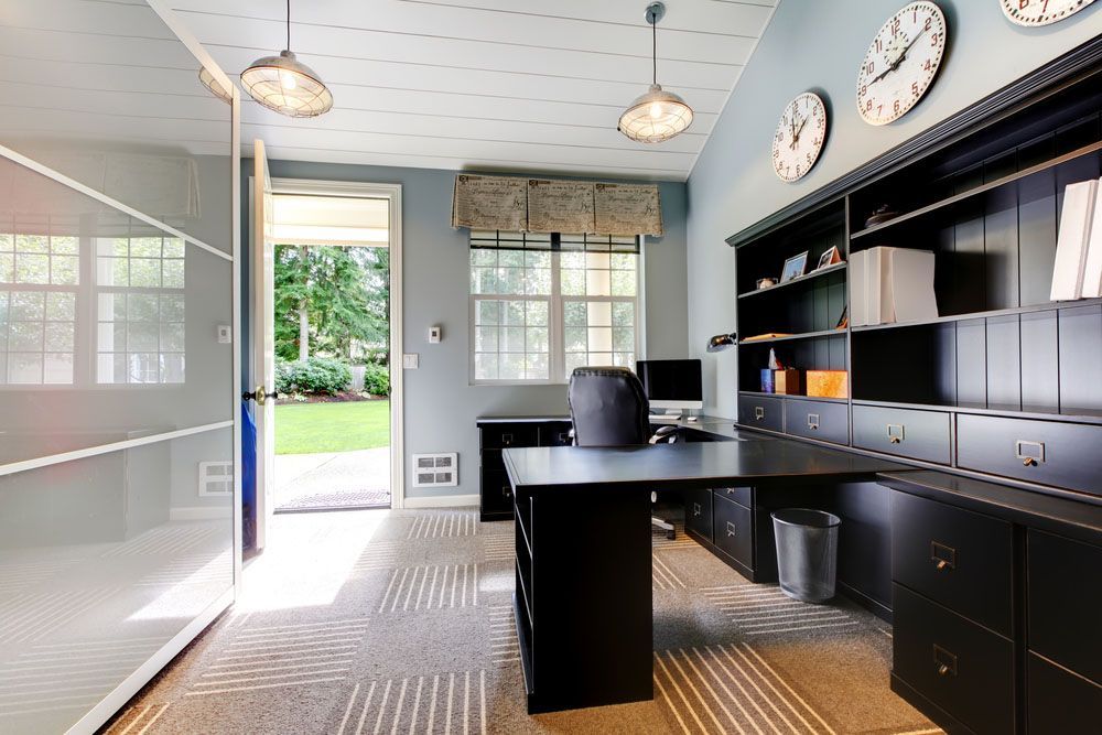 Office with Clocks and Desk — NBM Constructions in Canberra