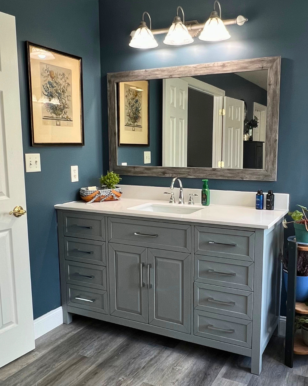 Spacious Bathroom Remodel with Blue Walls and Gray Vanity