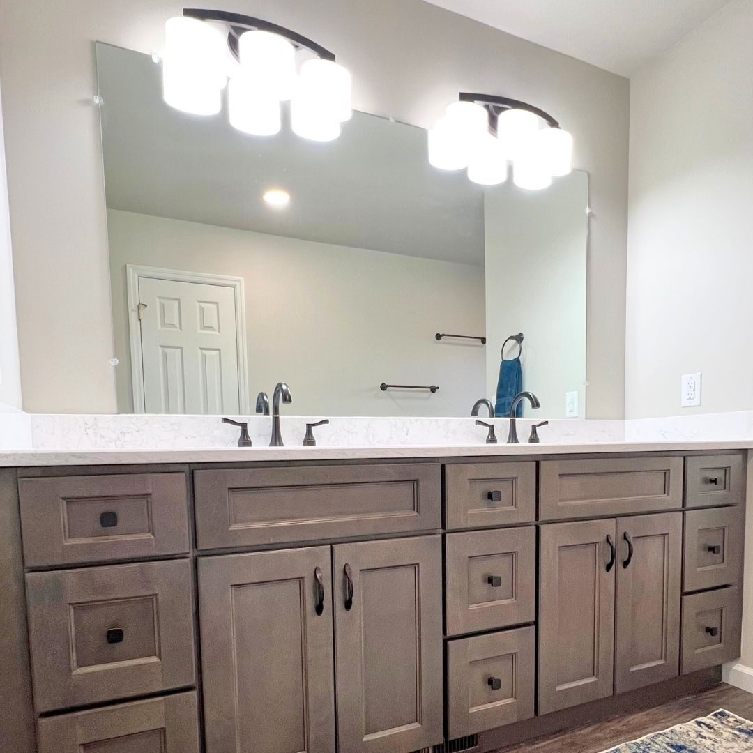 Beautiful Double Vanity with Mirror and Light Fixtures.